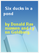 Six ducks in a pond